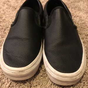 Black women’s Vans slip ons.